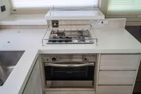 Modern kitchen in 2016 Leopard 40 yacht with stove and oven.