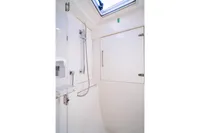 Shower area in 2016 Leopard 40 yacht, featuring sleek design and modern fixtures.