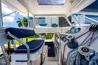 Interior view of 2016 Leopard 40 catamaran cockpit with steering wheel and seating.