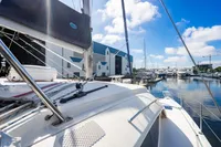 Sailboat docked at marina, Leopard 40 model, 2016, with clear blue sky.