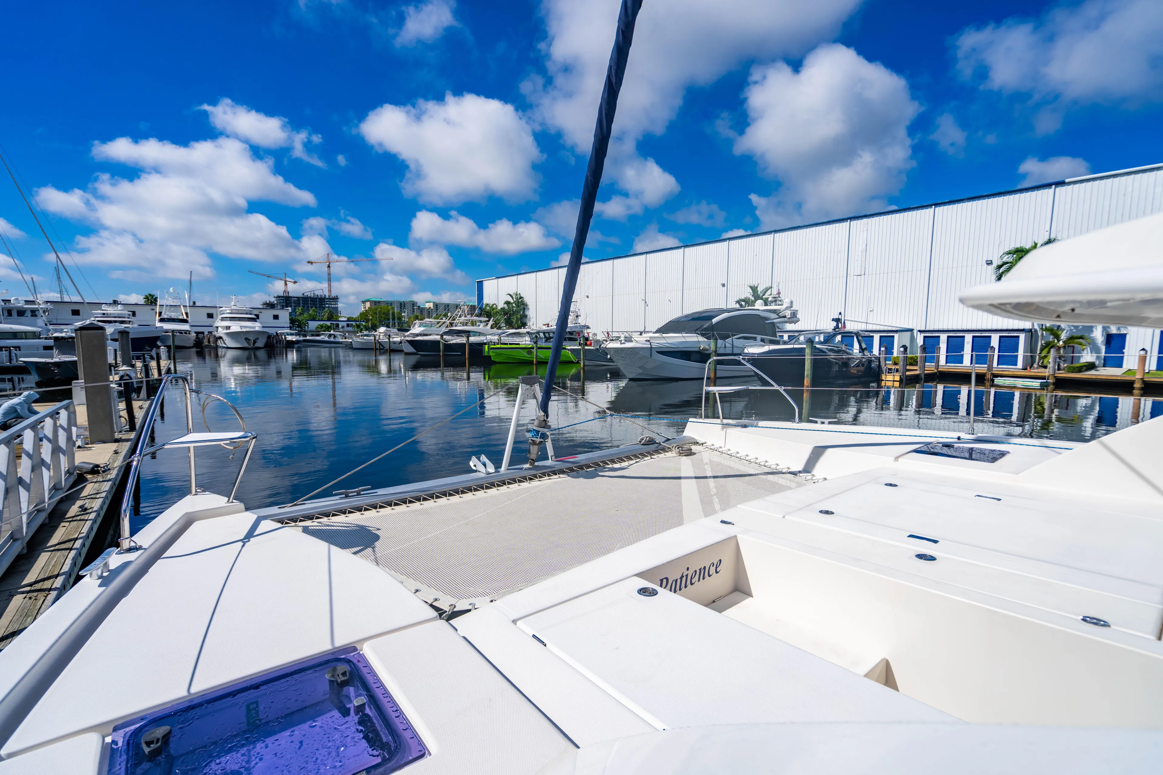 2016 Leopard 40 catamaran docked at a marina with clear blue skies.
