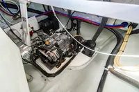 Engine compartment of a 2016 Leopard 40 catamaran, showcasing wiring and mechanical components.