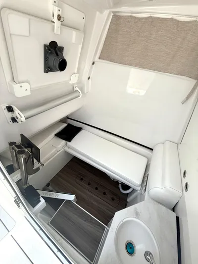  Yacht Photos Pics 2024 Sportsman 322 Open cabin interior with seating, sink, and modern amenities.