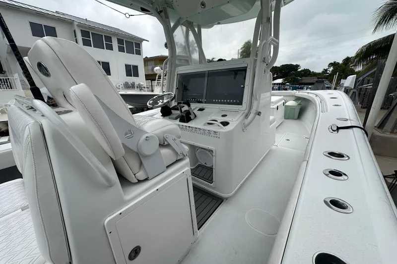  Yacht Photos Pics 2012 Yellowfin 32 Offshore boat interior with helm and seating area.