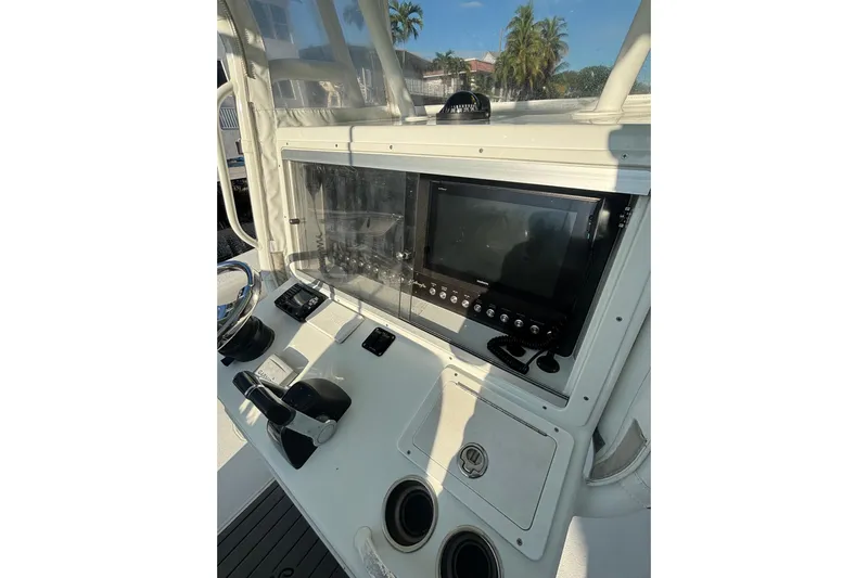  Yacht Photos Pics 2012 Yellowfin 32 Offshore boat console with navigation equipment and controls.