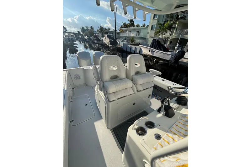  Yacht Photos Pics 2012 Yellowfin 32 Offshore boat interior with dual seats and canal view.
