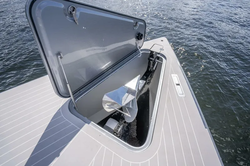 Warriors At Sea Yacht Photos Pics Open anchor compartment on 2016 VanDutch 55 yacht, with visible water background.