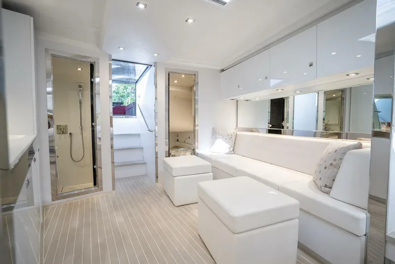 Warriors At Sea Yacht Photos Pics Luxurious interior of 2016 VanDutch 55 yacht with modern white furnishings and sleek design.