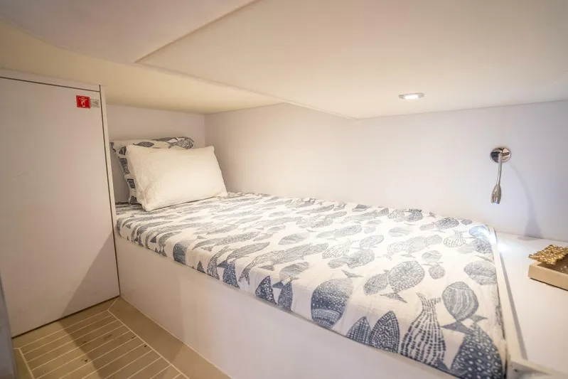 Warriors At Sea Yacht Photos Pics Cozy cabin bed in 2016 VanDutch 55 yacht with patterned bedding and reading light.
