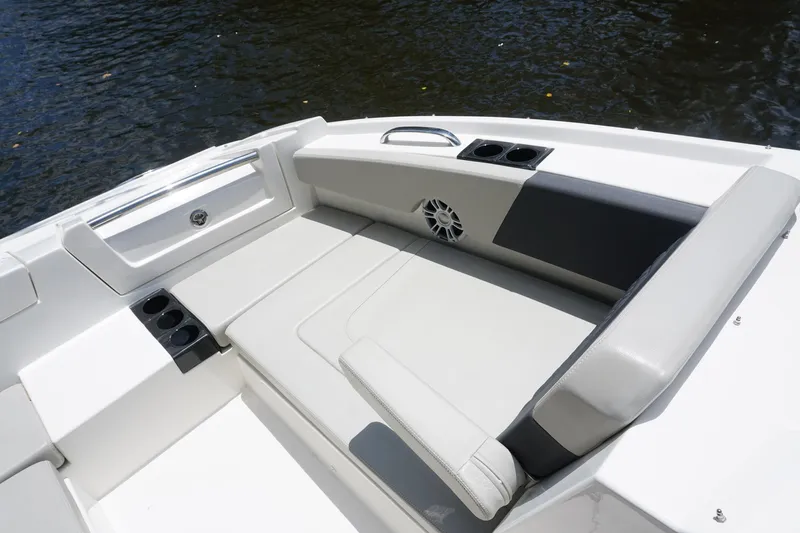 Sea)3 Yacht Photos Pics Aquila 32 Sport 2022 boat interior with cushioned seating and cup holders.