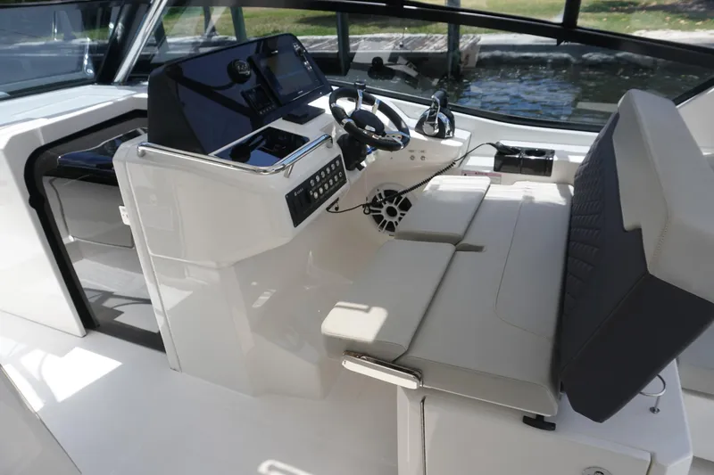 Sea)3 Yacht Photos Pics 2022 Aquila 32 Sport boat interior with modern helm and seating.