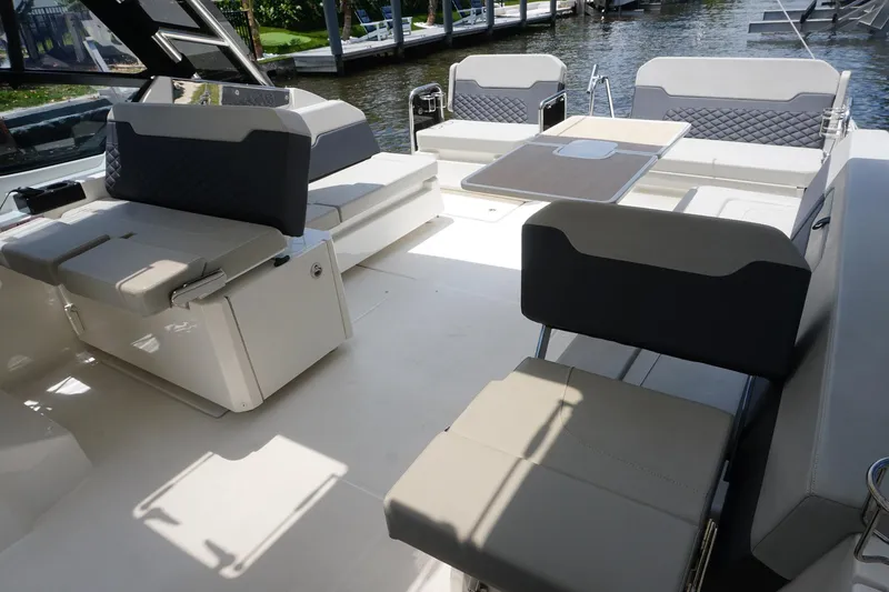 Sea)3 Yacht Photos Pics 2022 Aquila 32 Sport boat interior with spacious seating and modern design.
