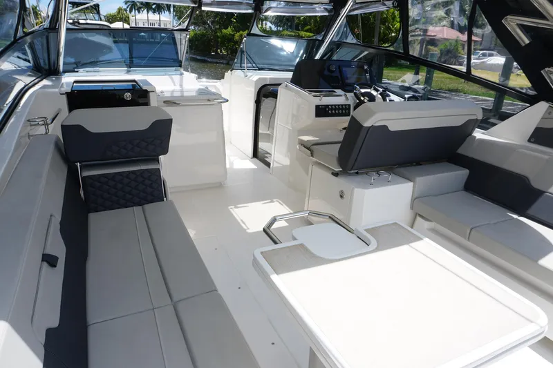 Sea)3 Yacht Photos Pics Aquila 32 Sport 2022 boat interior with modern seating and sleek design.