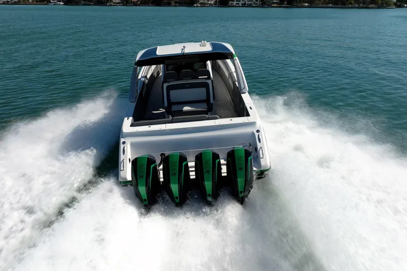  Yacht Photos Pics 2024 Cigarette 42' Auroris speedboat with four engines cruising on open water.