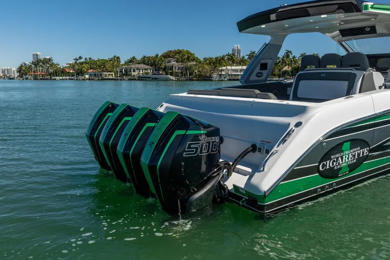  Yacht Photos Pics 2024 Cigarette 42' Auroris boat with powerful outboard engines on a sunny day.