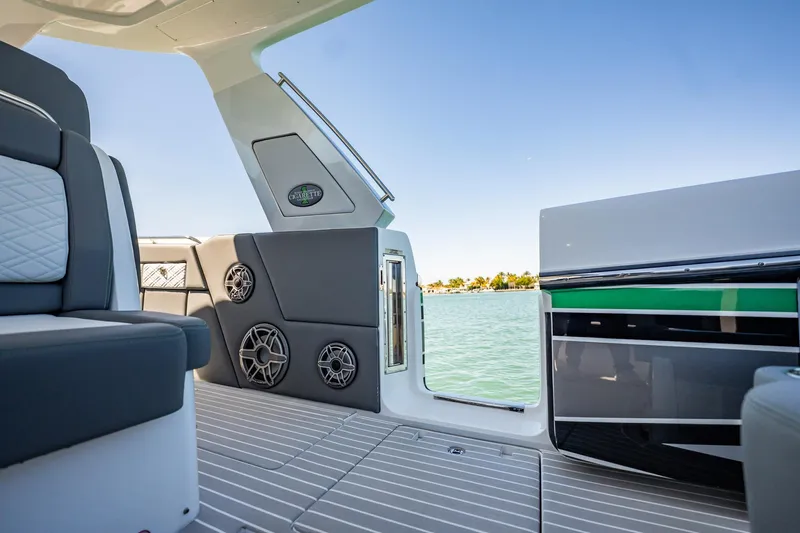  Yacht Photos Pics 2024 Cigarette 42' Auroris boat interior with sleek seating and water view.