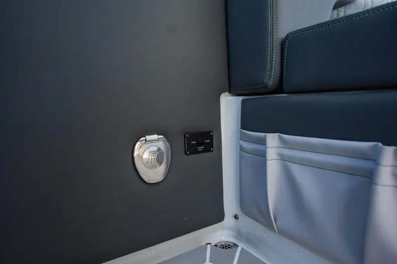  Yacht Photos Pics 2024 Cigarette 42' Auroris interior detail with storage pocket and metal fixture.