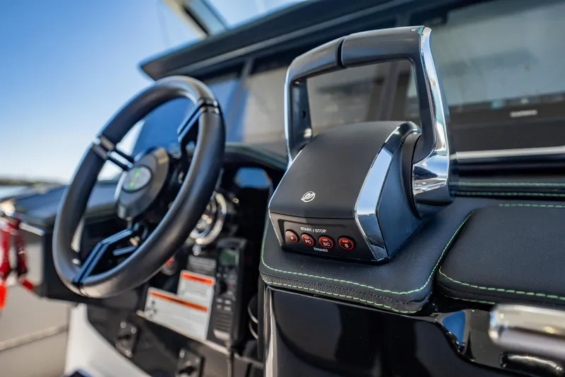  Yacht Photos Pics 2024 Cigarette 42' Auroris boat dashboard with steering wheel and throttle controls.