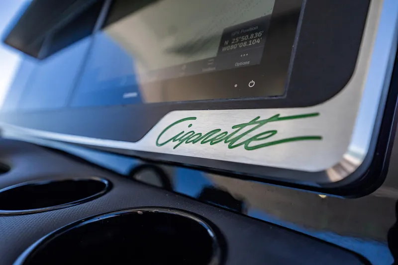 Yacht Photos Pics Close-up of 2024 Cigarette 42' Auroris dashboard with logo and display screen.