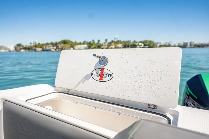  Yacht Photos Pics 2024 Cigarette 42' Auroris boat with open storage compartment, ocean view.