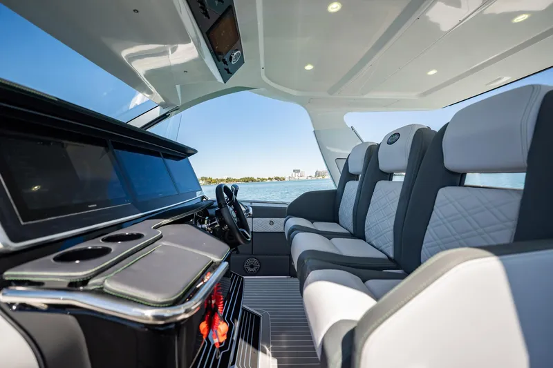  Yacht Photos Pics 2024 Cigarette 42' Auroris luxury boat interior with modern seating and dashboard.