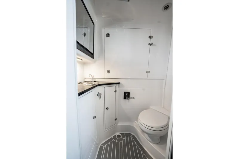  Yacht Photos Pics 2024 Cigarette 42' Auroris boat bathroom with modern fixtures and sleek design.