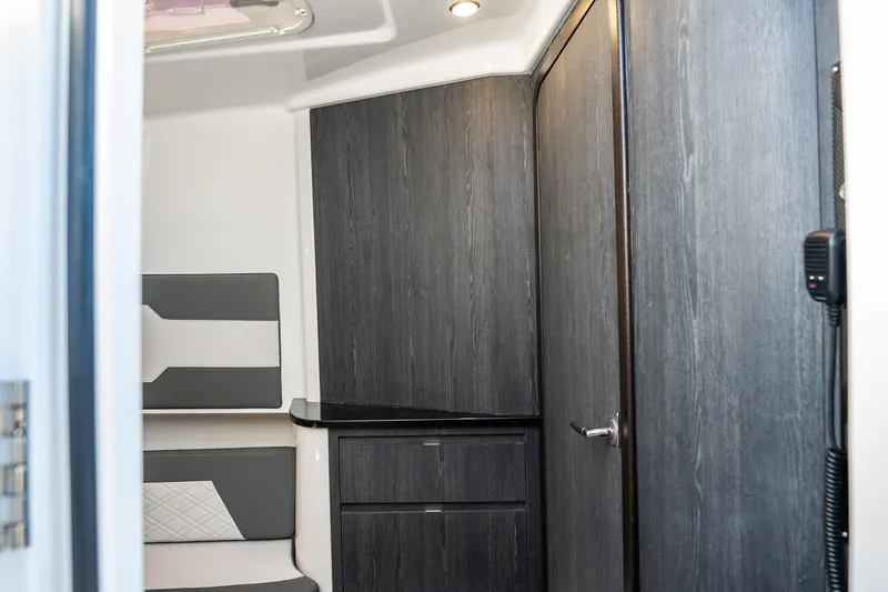  Yacht Photos Pics 2024 Cigarette 42' Auroris interior with sleek wood paneling and modern seating.