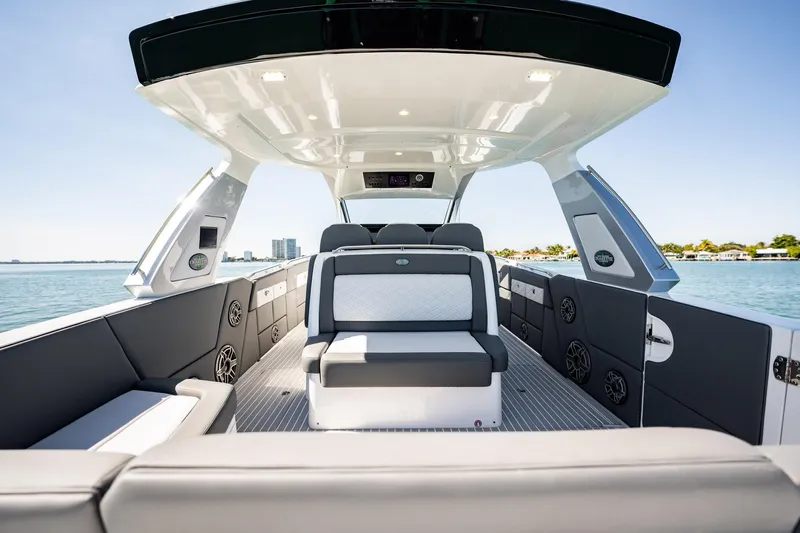  Yacht Photos Pics 2024 Cigarette 42' Auroris luxury boat interior with modern seating and sleek design on open water.