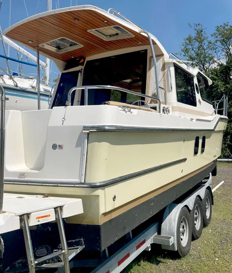 Seaburd Yacht Photos Pics 2018 Ranger Tugs R-29 S boat on trailer, side view, sunny day.