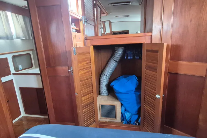 Burnin Daylight Yacht Photos Pics Interior of 1983 Grand Banks 42 Classic yacht with wooden cabinetry and storage compartment.