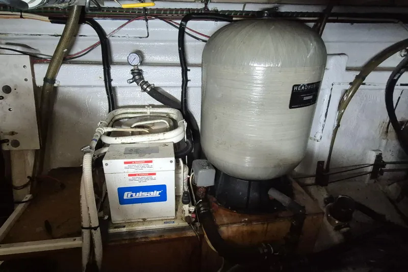 Burnin Daylight Yacht Photos Pics Engine room of 1983 Grand Banks 42 Classic with Cruisair unit and Headhunter tank.