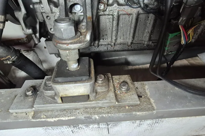 Burnin Daylight Yacht Photos Pics Engine mount of a 1983 Grand Banks 42 Classic boat, showing bolts and wiring.