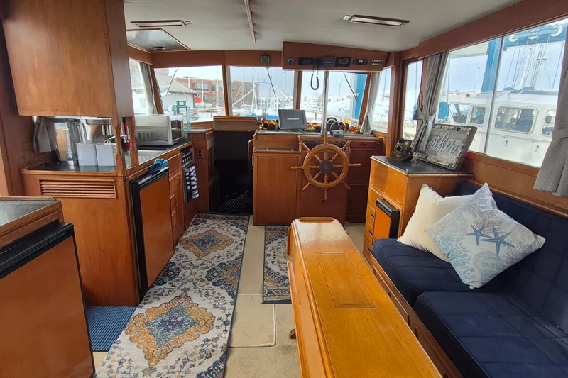 Burnin Daylight Yacht Photos Pics Interior of 1983 Grand Banks 42 Classic yacht with wooden furnishings and nautical decor.