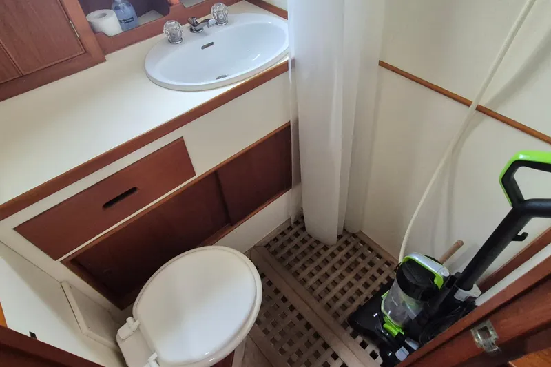 Burnin Daylight Yacht Photos Pics Bathroom interior of 1983 Grand Banks 42 Classic yacht with sink and toilet.