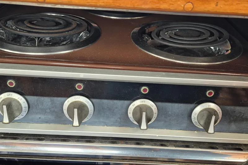 Burnin Daylight Yacht Photos Pics Electric stove with four coil burners and control knobs on a 1983 Grand Banks 42 Classic.