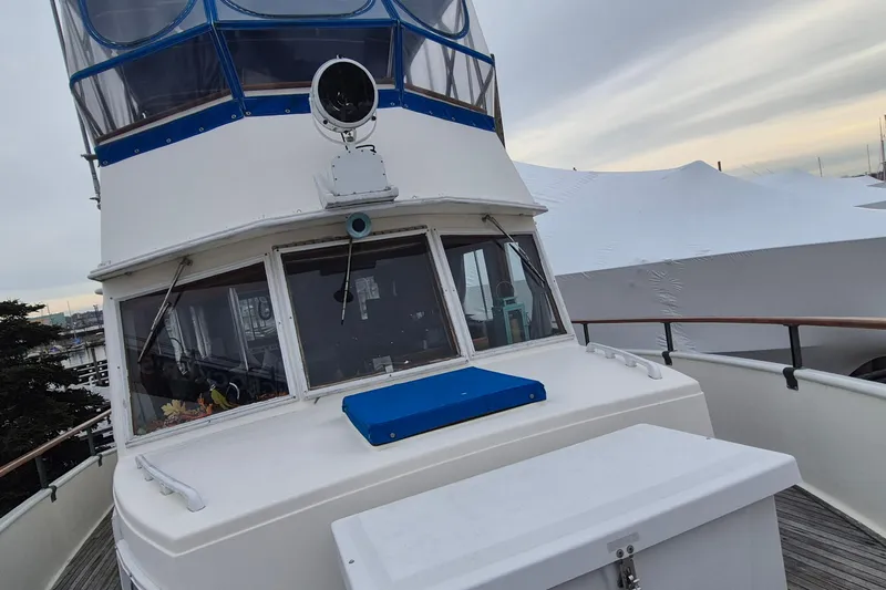Burnin Daylight Yacht Photos Pics 1983 Grand Banks 42 Classic yacht with blue accents docked at marina.