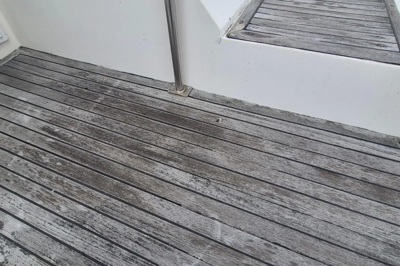 Burnin Daylight Yacht Photos Pics Weathered wooden deck of 1983 Grand Banks 42 Classic boat.