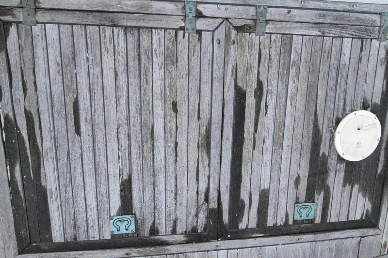 Burnin Daylight Yacht Photos Pics Weathered wooden hatch on 1983 Grand Banks 42 Classic boat.