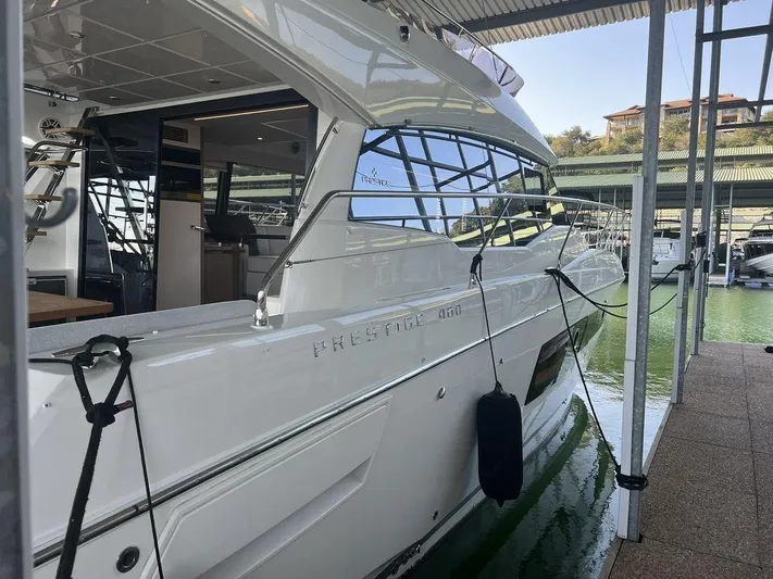 Velkommen Yacht Photos Pics 2022 Prestige 460F yacht docked in marina, sleek design, modern interior visible.