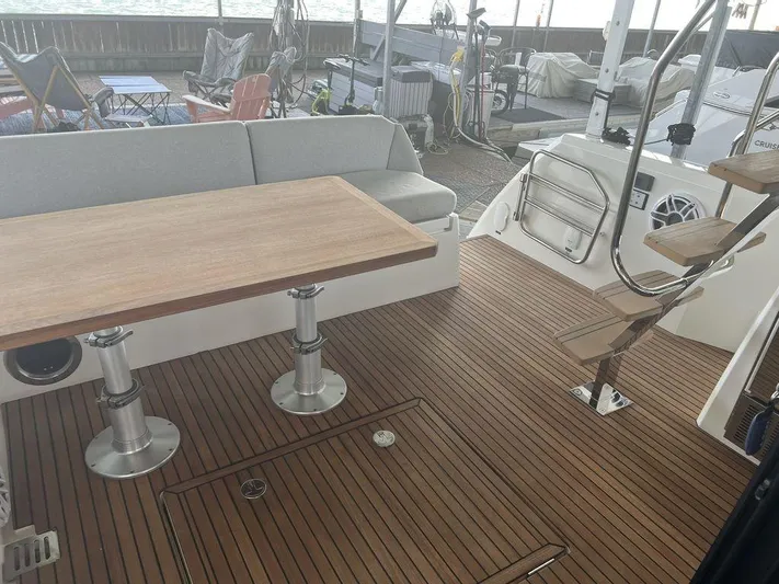 Velkommen Yacht Photos Pics Prestige 460F 2022 yacht deck with wooden flooring and seating area.
