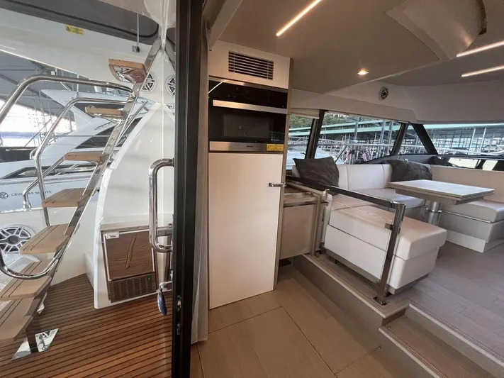 Velkommen Yacht Photos Pics Interior of 2022 Prestige 460F yacht with modern seating and sleek design.