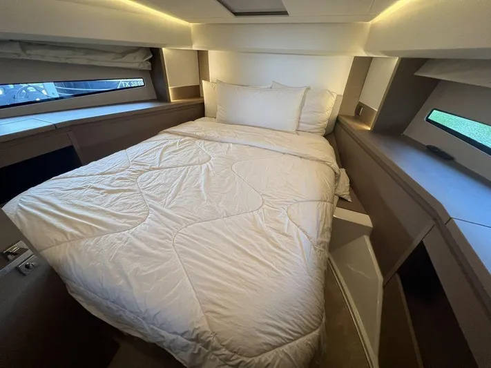 Velkommen Yacht Photos Pics Luxurious bedroom interior of 2022 Prestige 460F yacht with cozy bedding.