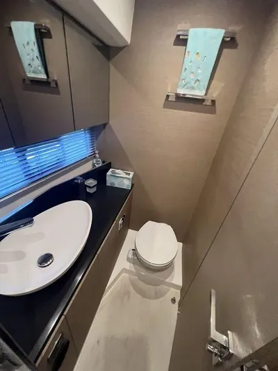 Velkommen Yacht Photos Pics Modern bathroom in 2022 Prestige 460F yacht with sleek sink and toilet.