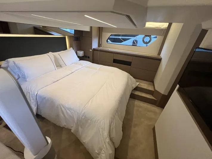 Velkommen Yacht Photos Pics Luxurious bedroom interior of 2022 Prestige 460F yacht with modern design and cozy bedding.