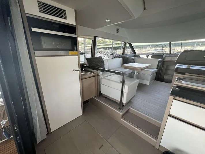 Velkommen Yacht Photos Pics Interior of 2022 Prestige 460F yacht with modern seating and dining area.