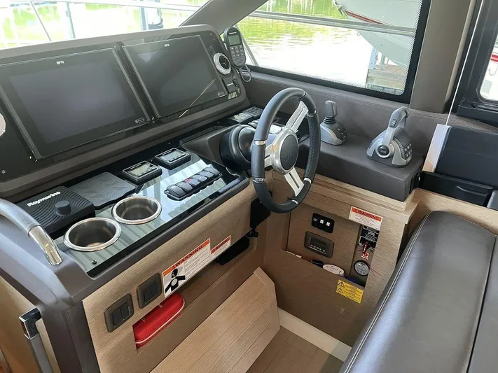 Velkommen Yacht Photos Pics Prestige 460F 2022 yacht helm with modern controls and navigation screens.