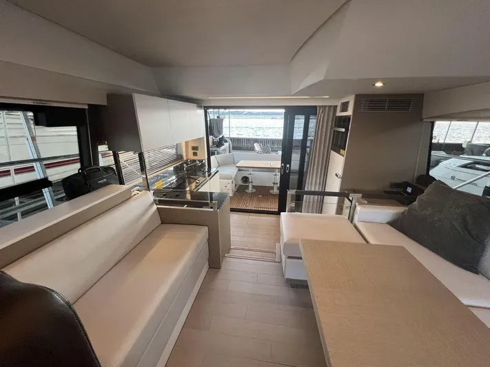 Velkommen Yacht Photos Pics Luxurious interior of 2022 Prestige 460F yacht with modern seating and elegant design.