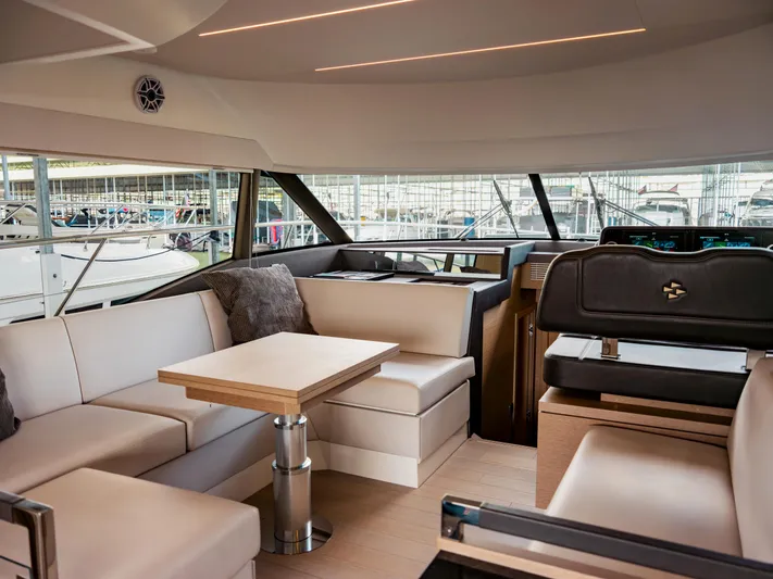 Velkommen Yacht Photos Pics Luxurious interior of 2022 Prestige 460F yacht with modern seating and elegant design.
