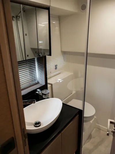 Velkommen Yacht Photos Pics Modern bathroom in 2022 Prestige 460F yacht with sleek sink and mirror.