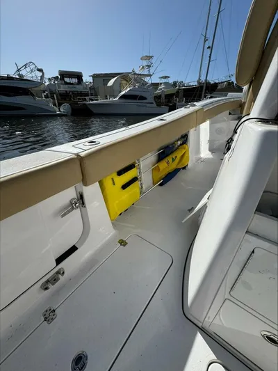  Yacht Photos Pics 2023 Sportsman boat interior with yellow life jackets, docked at marina.